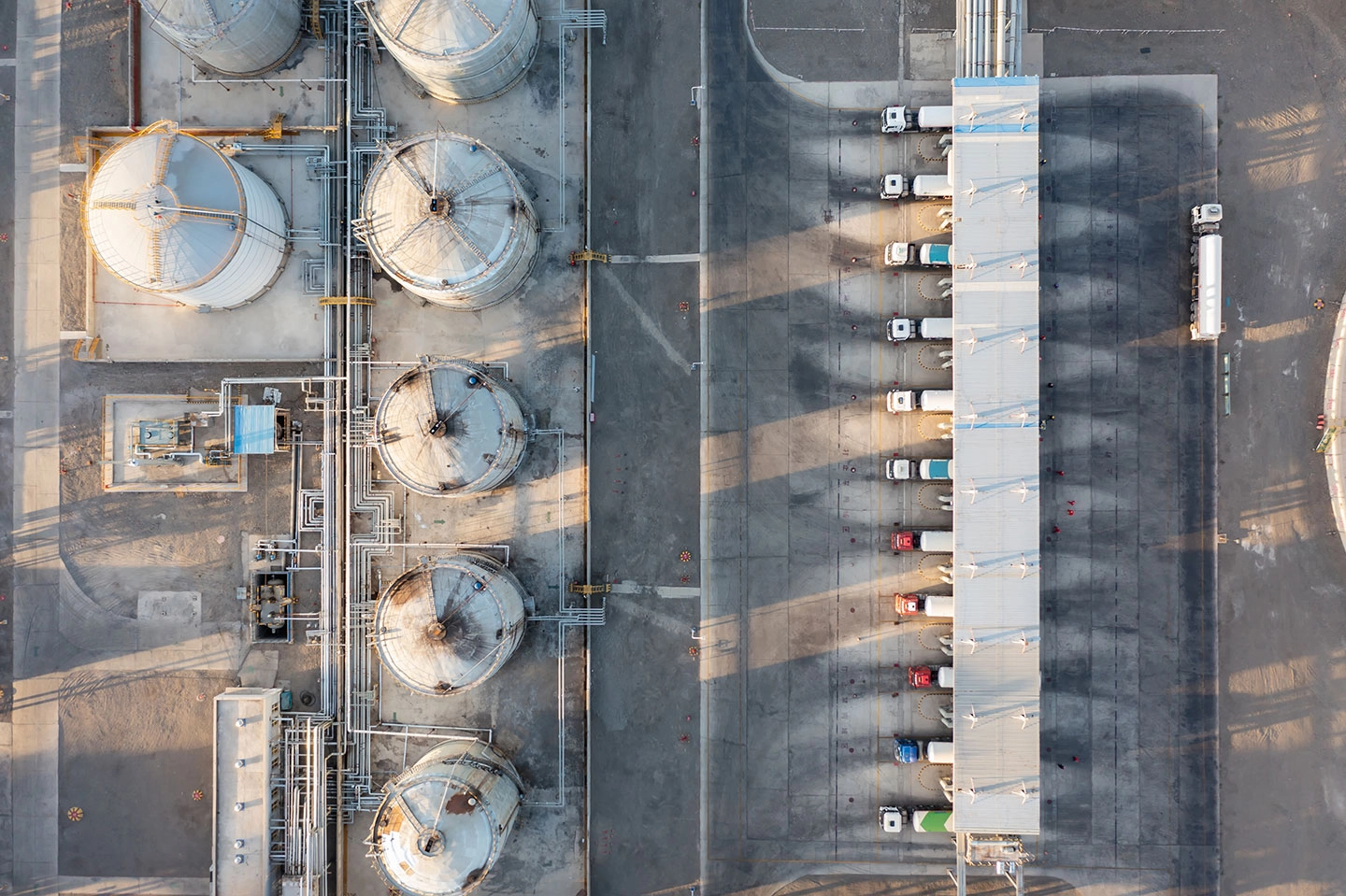 aerial view of an oil refinery and trucks aerial view of an oil refinery and trucks