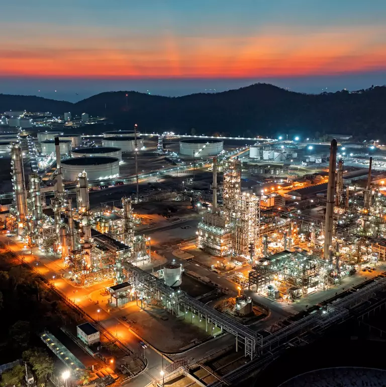 Aerial view of oil refinery at dusk