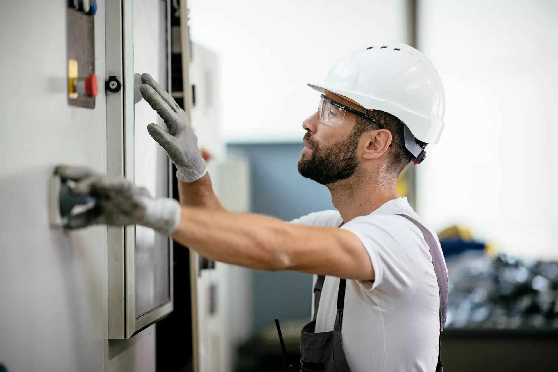 Industrial technician operating in electricity substation Industrial technician operating in electricity substation