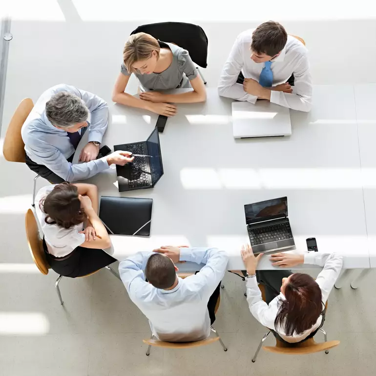 Overhead view of business people in a meeting Overhead view of business people in a meeting