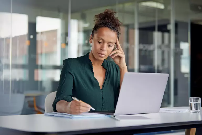 Portrait of pensive business woman working at desk Portrait of pensive business woman working at desk