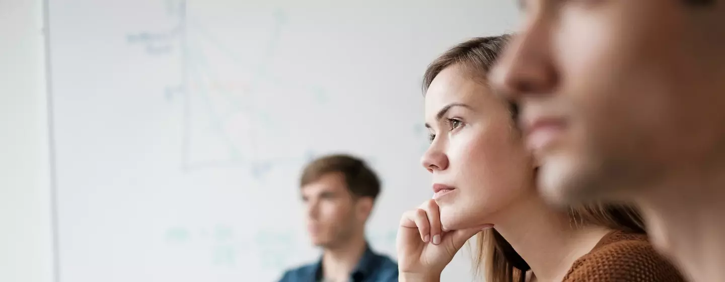 Student listening in college classroom