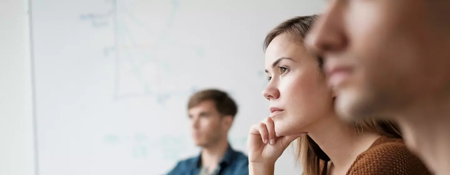 Student listening in college classroom